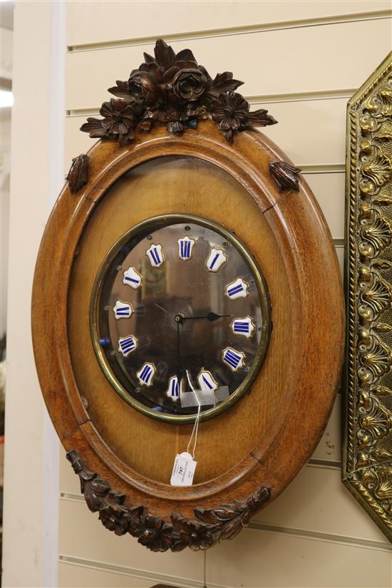 A French oak wall clock with quartz movement W.48cm